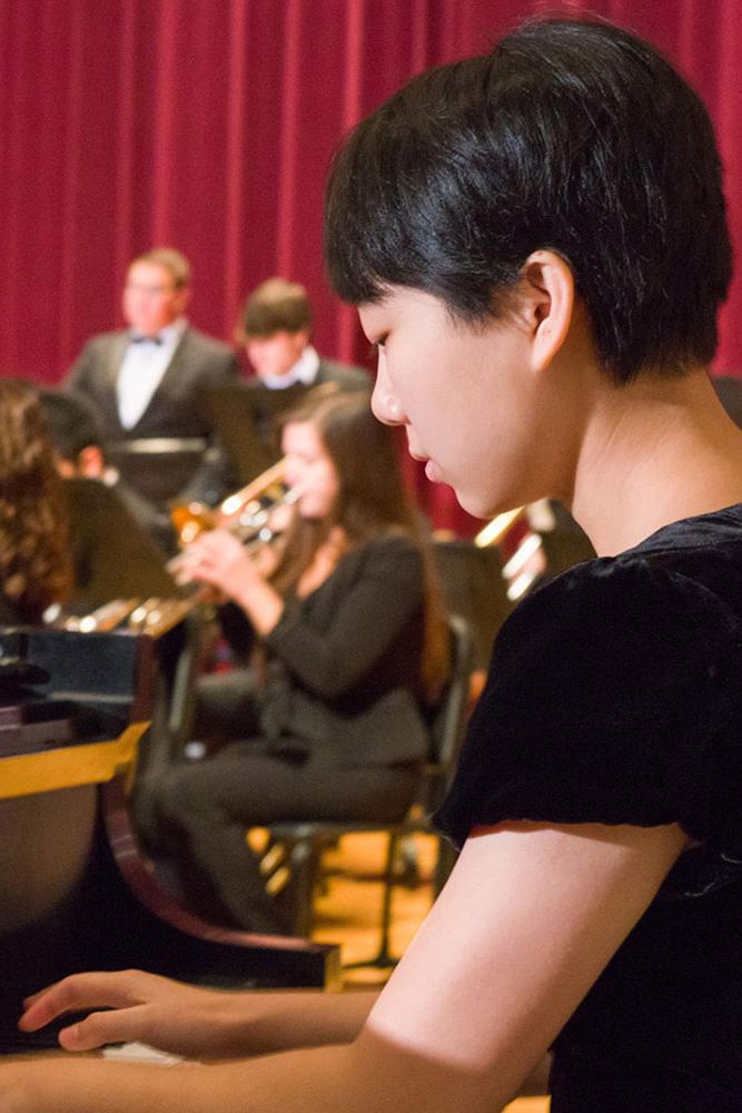 Capital student playing the piano